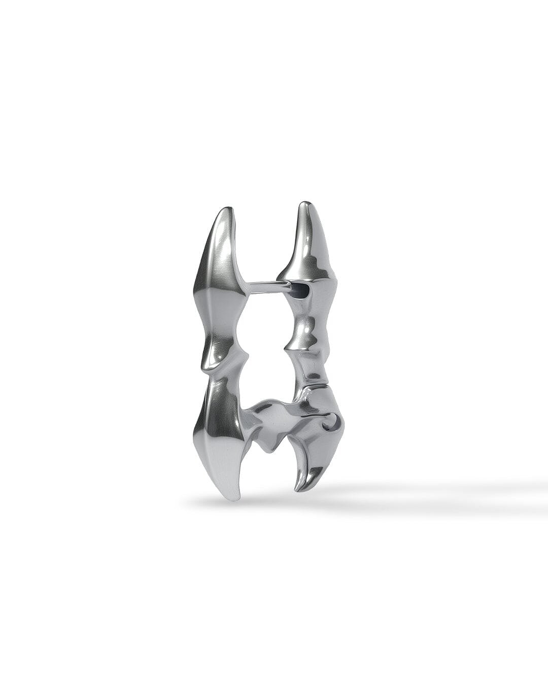 Side view of Obscure Spine - Frame Edition earrings showing curved star-spine interior and geometric silver frame design