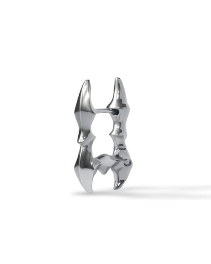 Side view of Obscure Spine - Frame Edition earrings showing curved star-spine interior and geometric silver frame design
