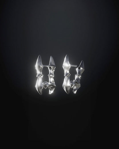 Pair of digitally sculpted sterling silver Star Spine earrings displayed on a black background by Oranda Jewelry